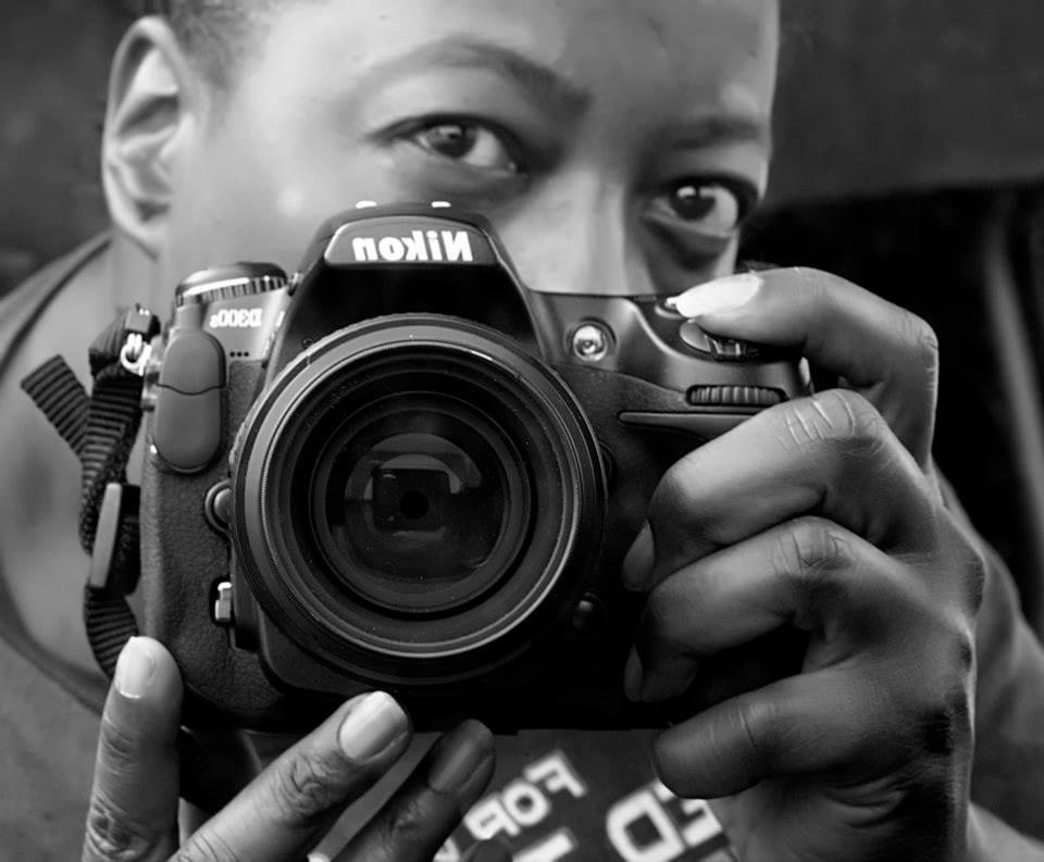 Marilyn Wilson looking through her Nikon camera